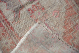 Distressed vintage Oushak rug pile with visible foundation wear and hand-knotted backing.