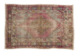 Vintage distressed Oushak rug, faded aubergine and seafoam green, geometric diamond medallion, worn texture, 2'8