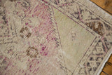 Original side cord selvage, worn Oushak pile, and faded ivory with pale mauve hues.