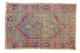 Vintage Distressed Oushak rug with aubergine and sky blue diamond medallion, soft pink and mint hues, 2'8