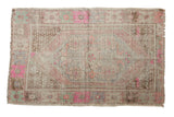 Vintage distressed Oushak rug, diamond medallion, in pale pink, mint, and brown, 2'9