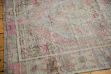 Worn texture and original selvage of this vintage Oushak rug, with pink details.