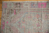 Distressed Oushak rug texture with even wear, vibrant bubblegum pink, blue, and brown tones.