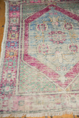 Distressed Oushak rug texture with softened blush, slate blue, and sea foam green.