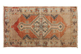 Vintage distressed Oushak runner with brick red geometric medallion, ivory details, and soft blue tones, 2'8