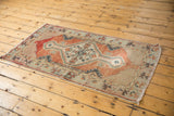 Vintage distressed Oushak runner corner, brick red and ivory lattice spandrel, worn pile.