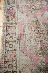 Distressed vintage Oushak runner edge detail, showing pale mauve, charcoal wear, and original selvage.