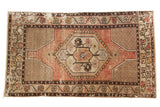 Decorative distressed Oushak rug with apricot mauve medallion and vinery motif, 3' x 5'4