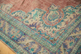 Vintage Oushak rug corner, ornate meandering vine border, distressed brick red, royal blue, mint.