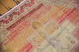 Vintage Oushak rug section: primitive geometric pattern, abrashed blush, sand, and red tones.
