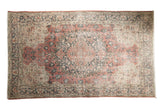 Vintage distressed Oushak carpet with dusty blush rose, charcoal, ivory quatrefoil medallion.