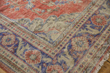 Vintage distressed Oushak carpet corner, faded red, royal blue, ivory patterns, mostly even wear.