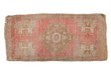 Distressed vintage Oushak runner rug: blush, copper, ivory stepped medallion, corner motifs.