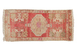 Vintage distressed Oushak runner, raspberry red field, antique ivory stepped medallion, corner plants, 1'9