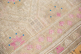 Hand-woven distressed Jijim rug panel with geometric raspberry flowers and sky blue accents.