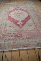 Original fringe and low pile of faded cherry red and beige Oushak rug border.