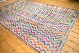 Vintage Turkish Jijim rug with zigzag chevrons and vibrant geometric border.