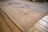 Low angle perspective on a vintage Oushak rug, highlighting its even, low-pile texture.