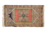 Distressed vintage Oushak rug mat with blush, grey, and navy quatrefoil medallion, 1'8