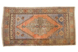 Hand-knotted Oushak runner with distressed apricot medallion, slate blue field, plant motifs.