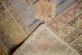 Vintage Distressed Oushak rug runner corner, showing textured pile and hand-knotted foundation.
