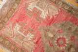 Distressed Oushak rug pile showcasing blush, ivory serrated, and oxidized silver plant motifs.