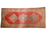 Distressed Oushak runner with triple silver Rococo medallions on abrashed cherry red, 5'x10'9
