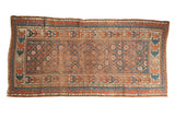 Early 20th century Caucasian rug, allover trellis, faded terra cotta and sky blue geometric borders.