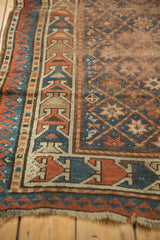 Antique Caucasian rug with geometric border in sky blue and terra cotta; showing light tatter.