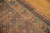 Antique Caucasian rug detail: trellis field, geometric border, terra cotta, blue, with mostly even wear.