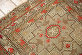 Sharp geometric drawing on the borders and medallion of an antique Caucasian rug.