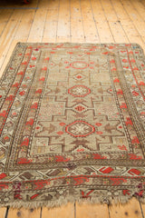 Antique Caucasian rug, overall bold geometric pattern featuring rust, silver, and charcoal tones.