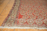 Secure ivory fringe, geometric border, and brick red pile with visible foundation showing.