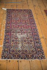 Vintage Yazd runner with allover floral trefoil pattern in wine red, navy, and beige, showing low pile and tatter.