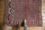 Antique Turkmen rug, allover fuchsia-purple field, navy blue and ivory tent motifs.