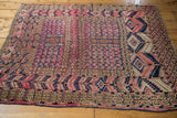 Antique Turkmen rug with fuchsia and purple tent cover design, bold navy geometric motifs.