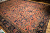 Blush rose field with sprawling navy vinery, floral motifs, and dark navy Lilihan border.