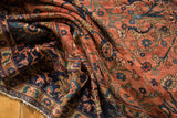 Textured pile of Lilihan carpet with sprawling vinery, blue palmettes, and blush rose field.