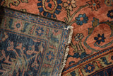 Blush dusty rose pile and intricate navy hand-knotted reverse of a vintage Lilihan rug.