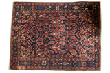 Dark navy Vintage Baktiari carpet with allover serrated leaves and floral blossoms, 9'4