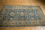 Lower corner of antique Caucasian Shirvan rug, showing oversized geometric serrated leaves, wear, and fringe.