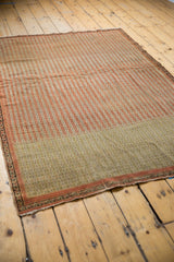 Low pile and even wear on a striped antique Senneh rug with visible color abrash.