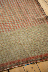 Fine, low pile of an antique Senneh rug with intricate seed motifs in parallel running lines.