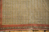 Even wear across the knot heads of a fine antique Senneh rug with a terracotta border.