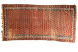 Antique Caucasian rug runner, madder root red with allover boteh design and historic patina.