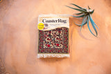 International Variety Pack CoasterRug with Jade Fars pictorial design in red, green, and cream.