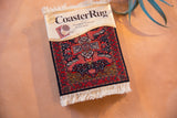 Packaged CoasterRug featuring a rare late 19th century Sarouk design in red, black, and ivory.