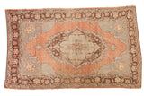 Distressed vintage Oushak rug, large geometric medallion on faded blush and blue. 4'11