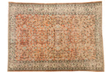 Vintage distressed Oushak carpet featuring apricot blush, scrolling floral vinery, and an antique ivory border.