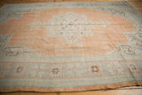 Vintage Distressed Oushak Carpet border with soft apricot, sea foam, and blue tones.